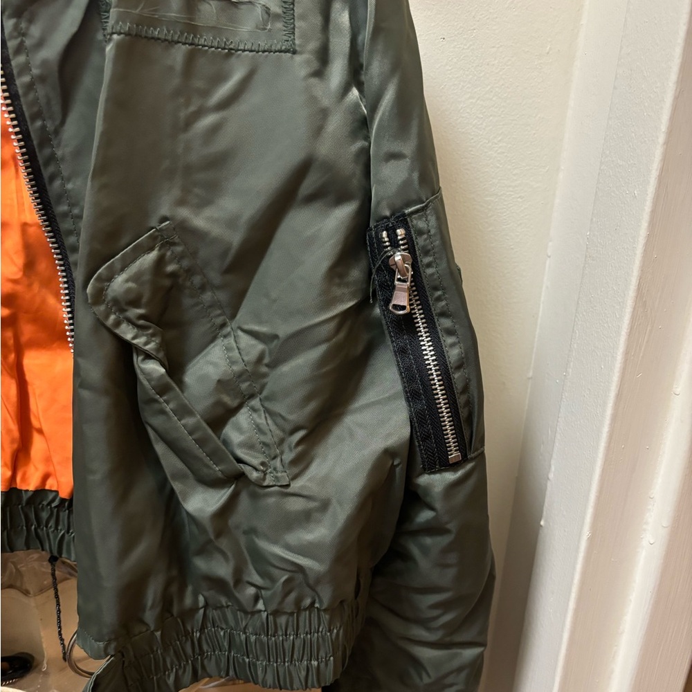 Green and orange crop style jacket.